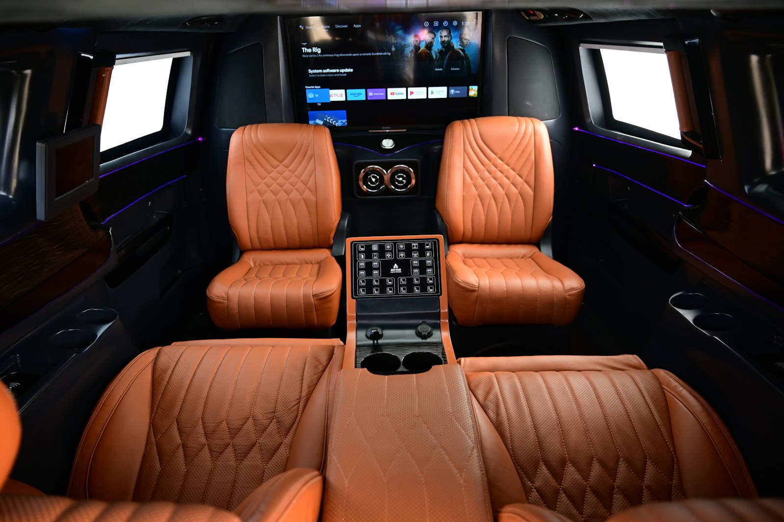 Executive Sprinter cabin with leather captain seating and entertainment screen
